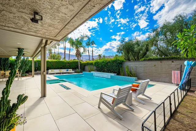 a view of backyard with sitting area