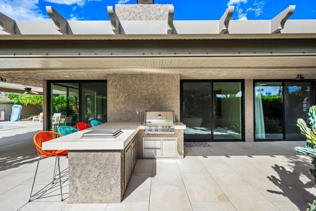 a view of a couches and table in the patio