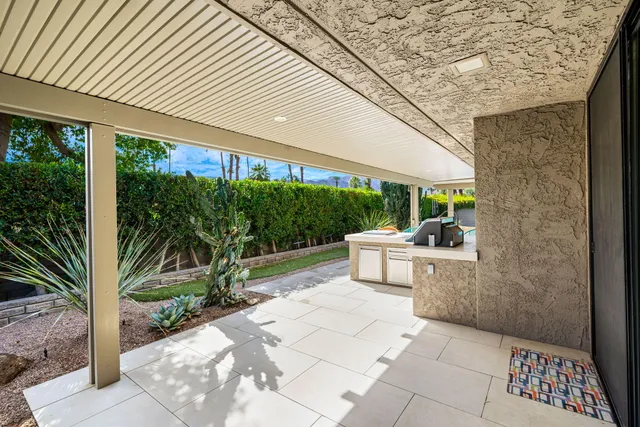 a view of a backyard with a patio