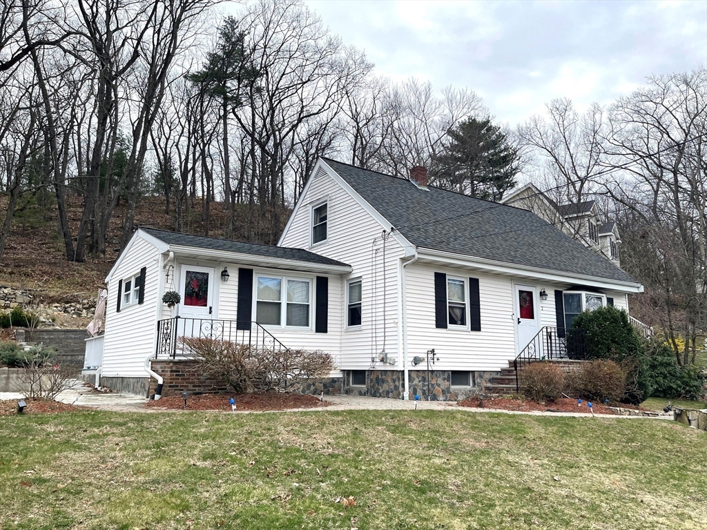 a front view of a house with a yard