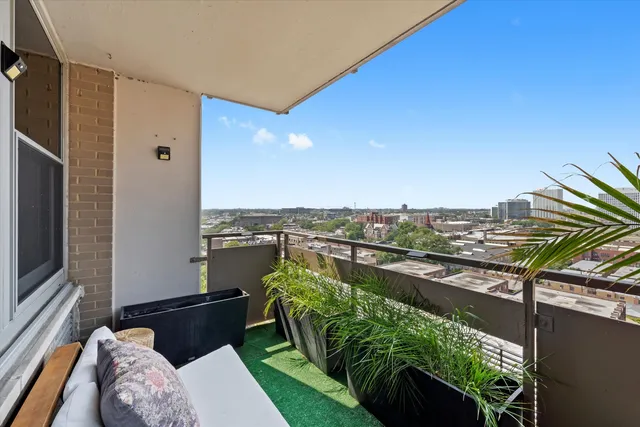 a view of a balcony with chairs
