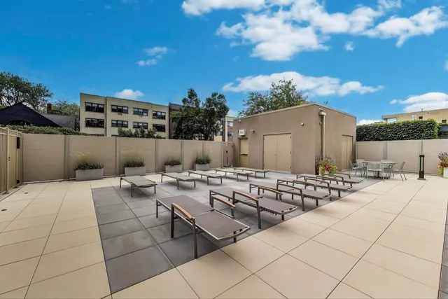 a view of backyard with sitting area