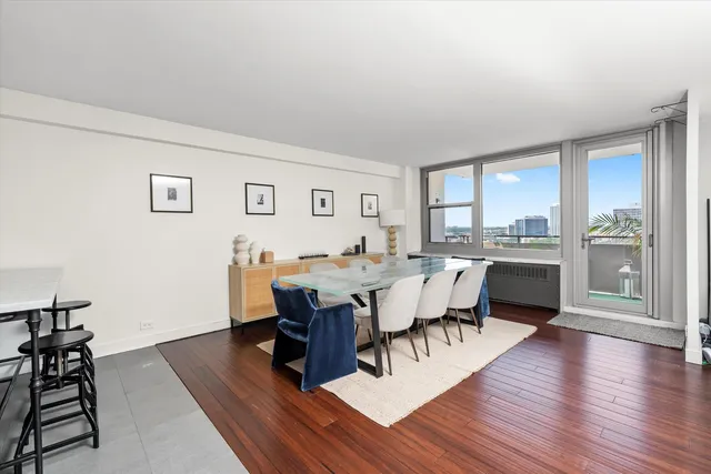 a view of a dining room with furniture window and wooden floor