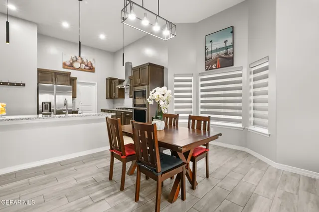 a kitchen with stainless steel appliances granite countertop a sink and a stove