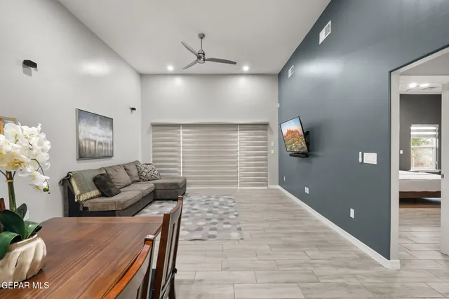 a kitchen with granite countertop a sink stove and refrigerator