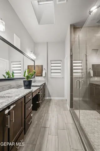 a bedroom with furniture and stairs