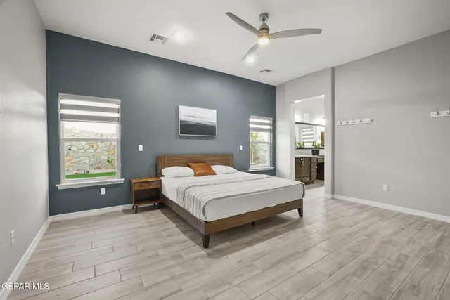 a view of a dining room with furniture wooden floor and chandelier