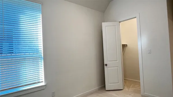 a view of a closet area with windows