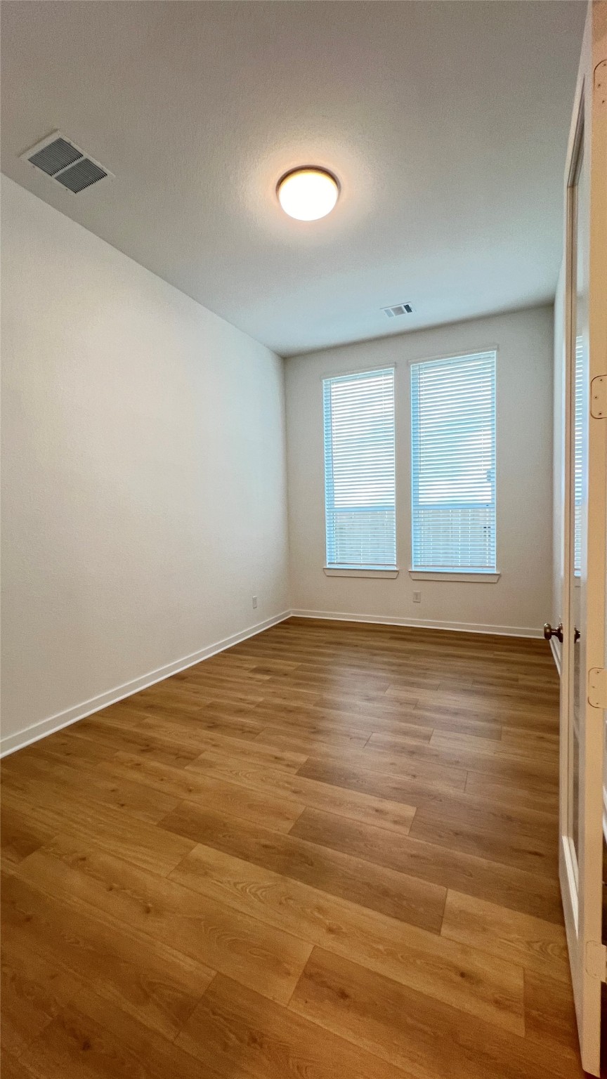 124 Stephens Rdg Lane Montgomery, TX 77316 - Photo 40 of 40 wooden floor in an empty room with a window
