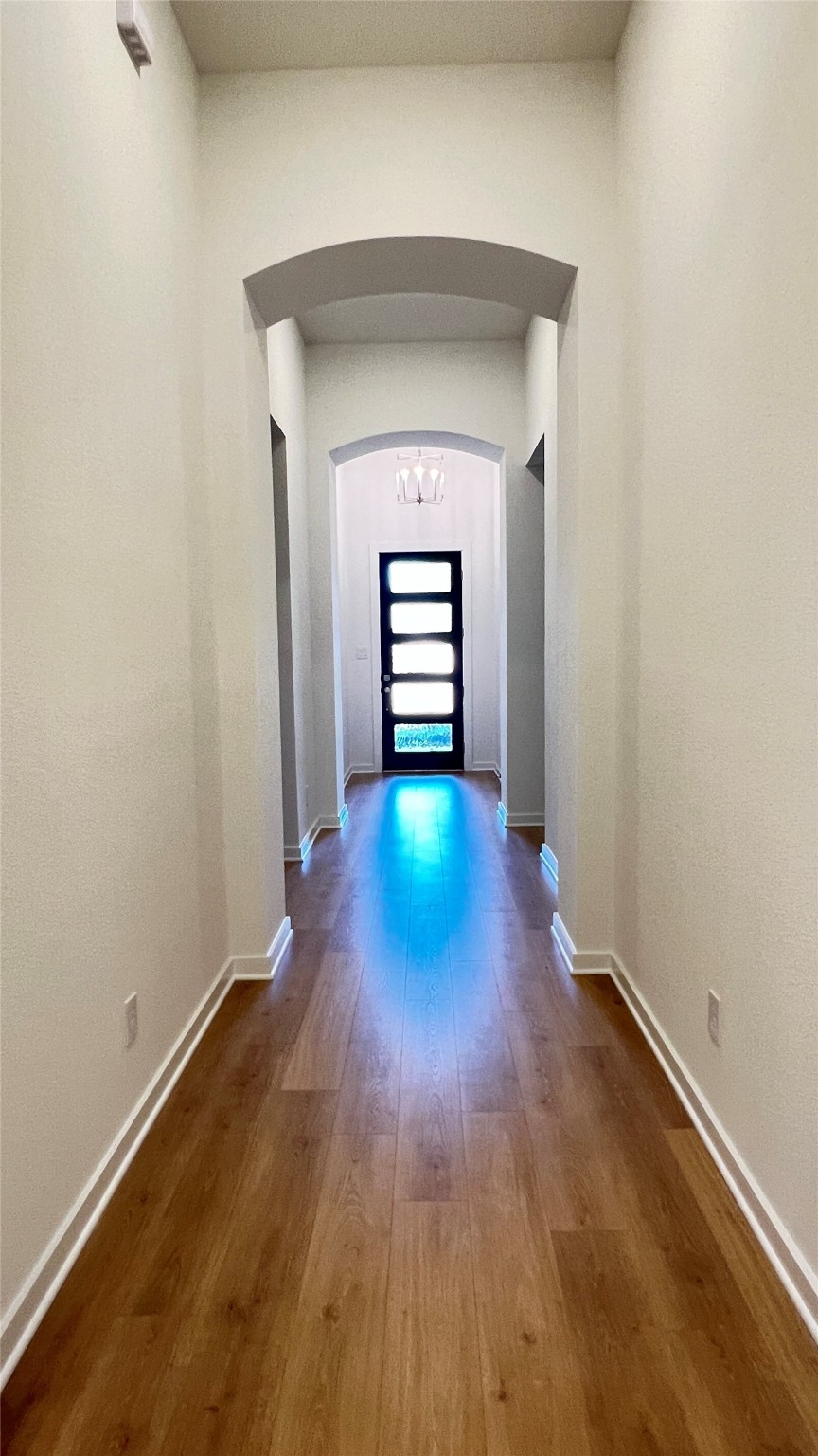 124 Stephens Rdg Lane Montgomery, TX 77316 - Photo 7 of 40 a view of a hallway with wooden floor