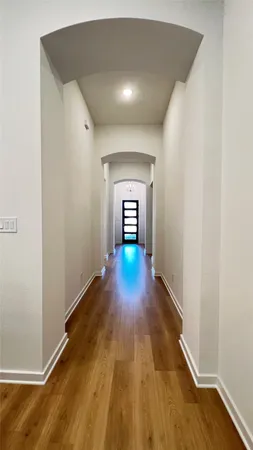 a view of gallery with wooden floor