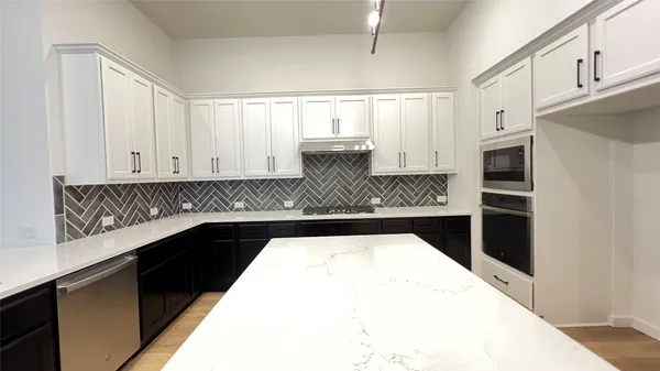 a kitchen with a sink and refrigerator
