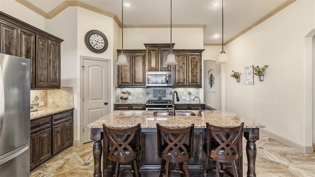 509 Alice Lane Fate, TX 75189 - Photo 8 of 36 Island seating to keep the chef company