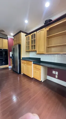 a view of a kitchen with a sink and a stove top oven