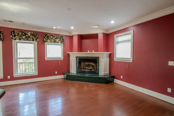 a view of a livingroom with hardwood floor and a ceiling fan