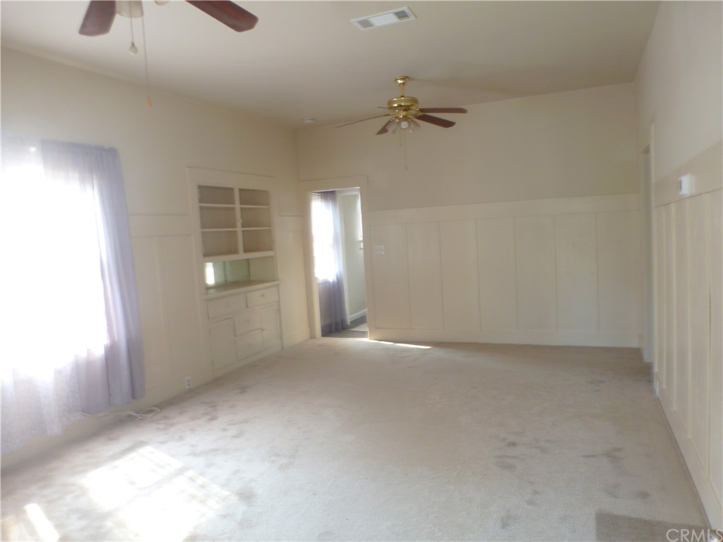 1044 West 20th Street Merced, CA 95340 - Photo 18 of 25 a view of an empty room with a window