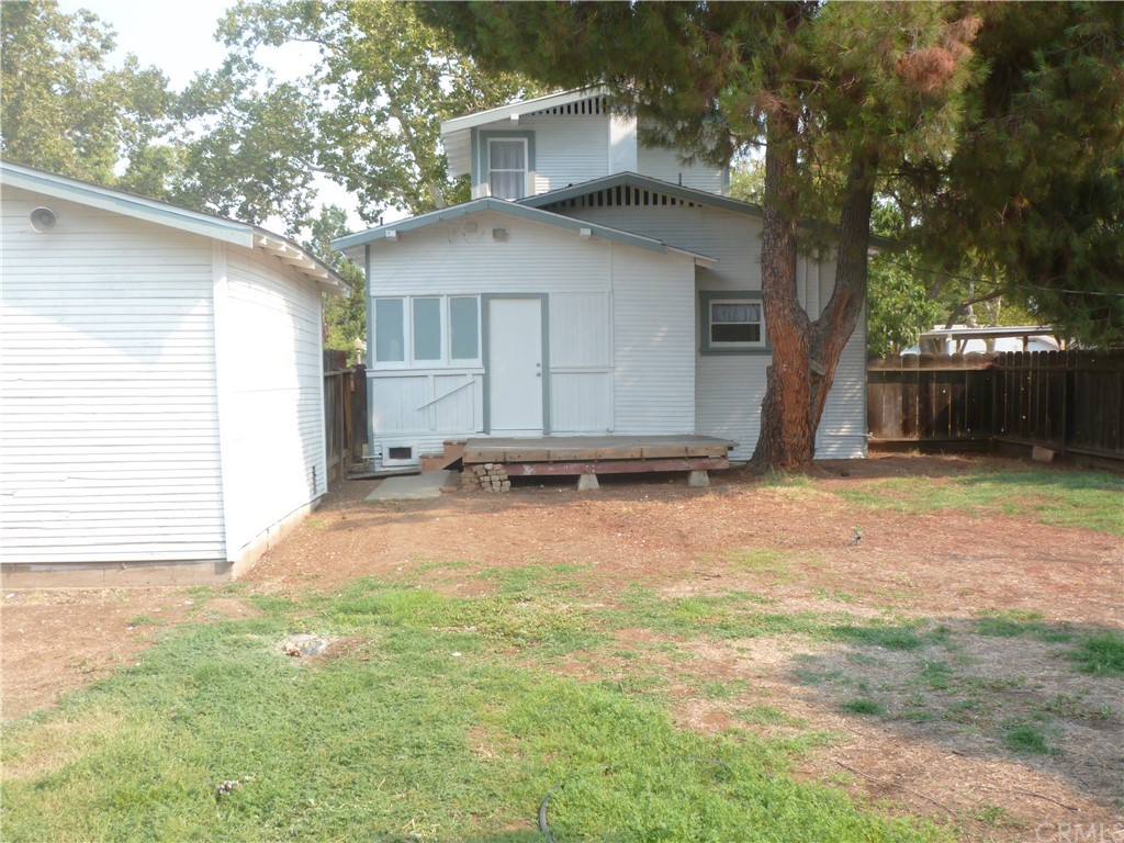 1044 West 20th Street Merced, CA 95340 - Photo 21 of 25 a view of a house with backyard and a tree