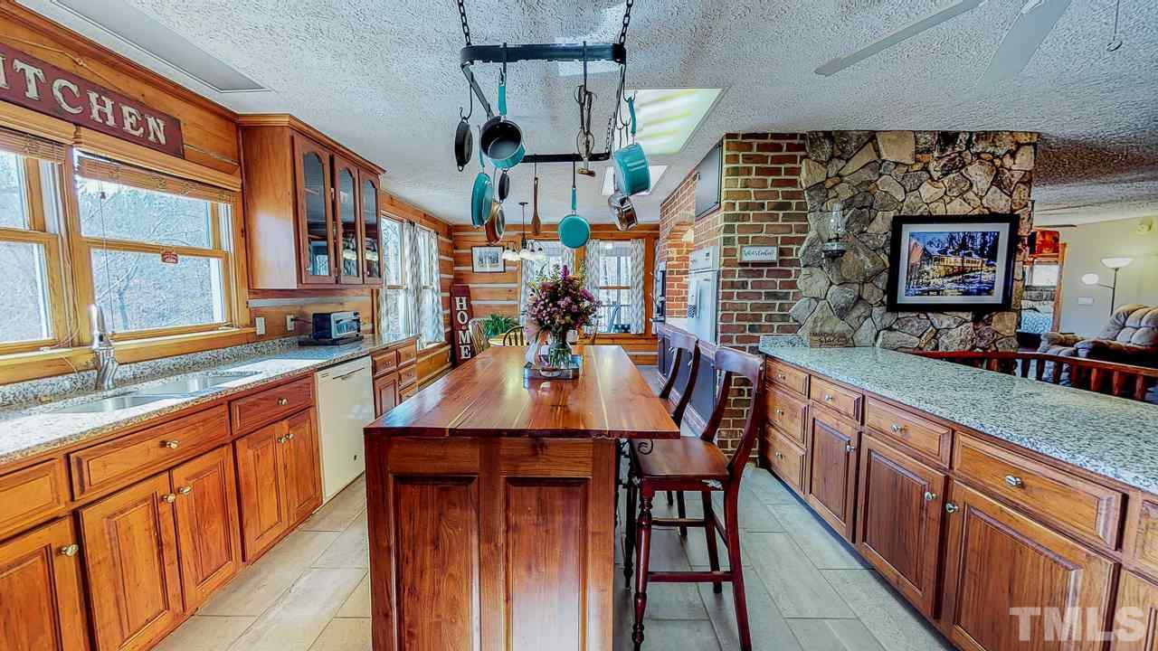 1530 Rolling Hills Road Roxboro, NC 27574 - Photo 3 of 30 So much counter space and a gorgeous island. Gorgeous views of the creek for the chef!