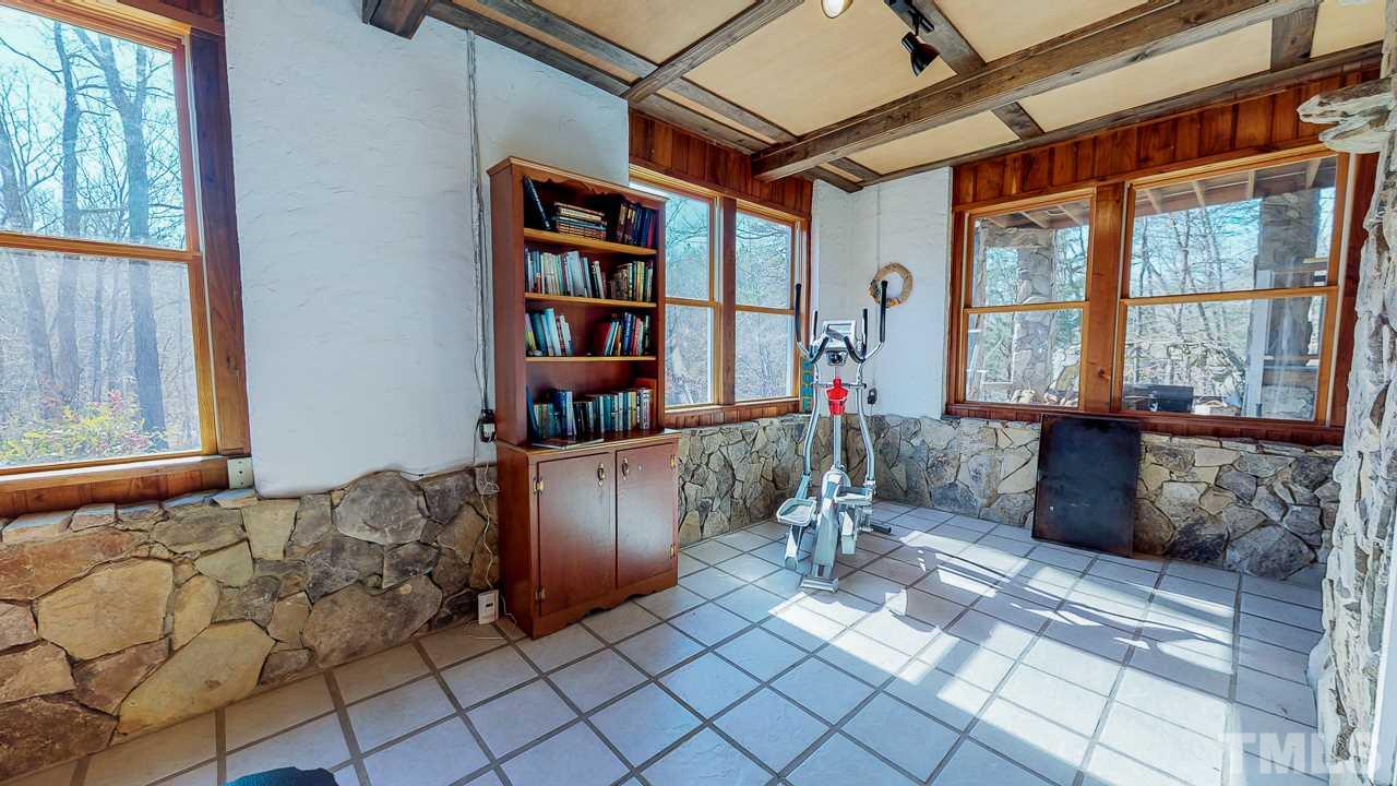 1530 Rolling Hills Road Roxboro, NC 27574 - Photo 23 of 30 Beautiful bright flex space in the finished basement is currently used as a study and workout room!