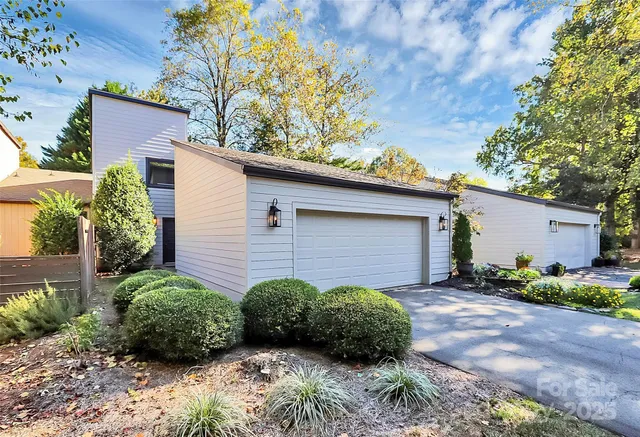 a view of a pathway in front of house