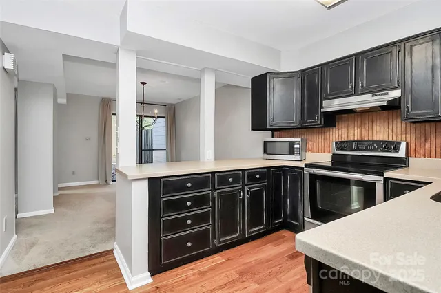 a kitchen with a stove and a sink