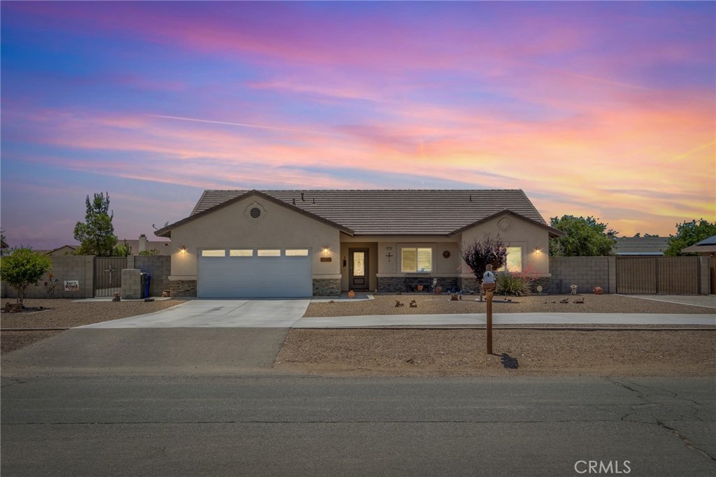 13178 Setancket Road Apple Valley, CA 92308 - Photo 1 of 24 a front view of a house with a yard