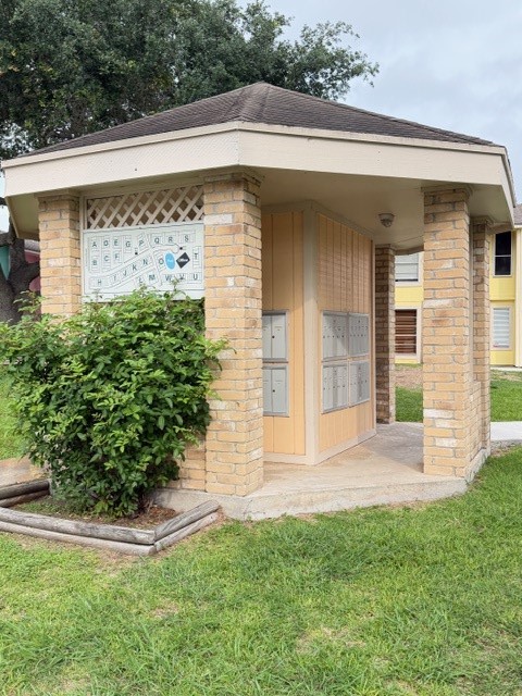 6702 Everhart Road, Unit A107 Corpus Christi, TX 78413 - Photo 11 of 13 a front view of a house with garden