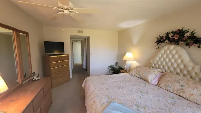 a white toilet sitting next to a bathroom sink and a shower