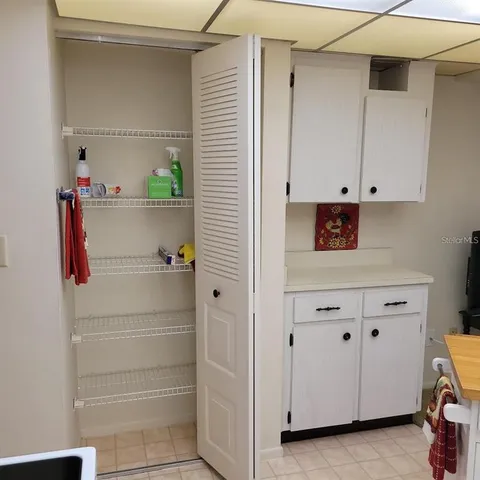 a view of an ocean building and trees in the background