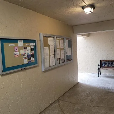 a view of a hallway and closet