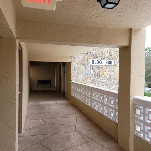 a view of a door and a hallway