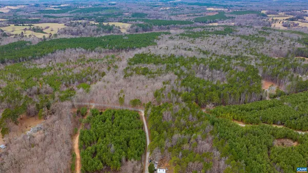a view of a pathway with a yard