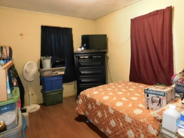 a bedroom with a bed and furniture