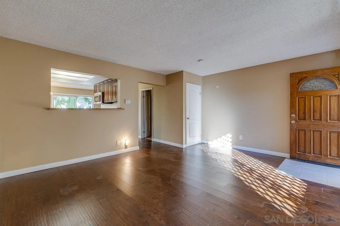 948 Gillespie Drive Spring Valley, CA 91977 - Photo 12 of 20 a view of livingroom with hardwood floor and window