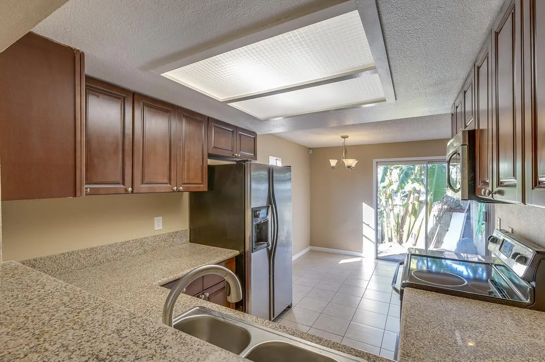 948 Gillespie Drive Spring Valley, CA 91977 - Photo 14 of 20 a view of a livingroom with furniture staircase and a ceiling fan