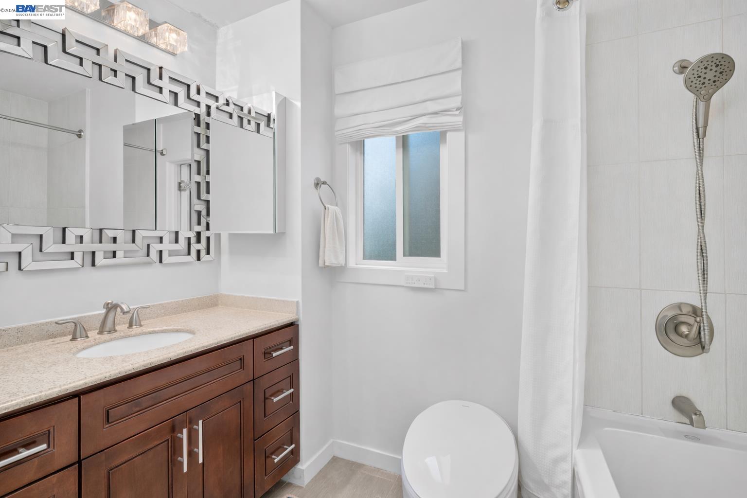 24849 2nd Street Hayward, CA 94541 - Photo 19 of 24 a bathroom with a sink vanity granite tub and a mirror