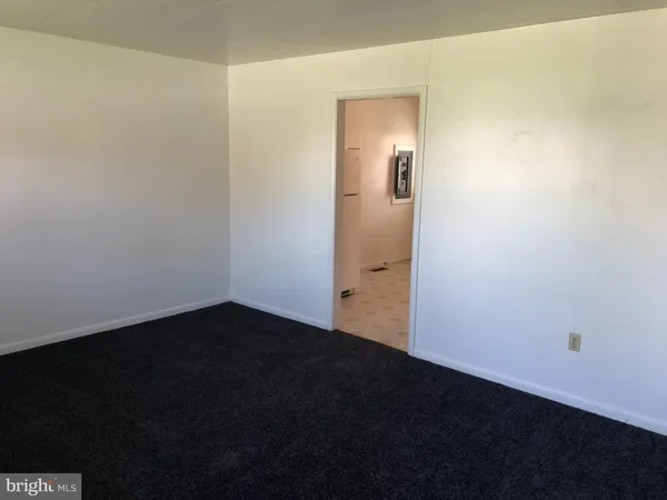 an empty room with wooden floor
