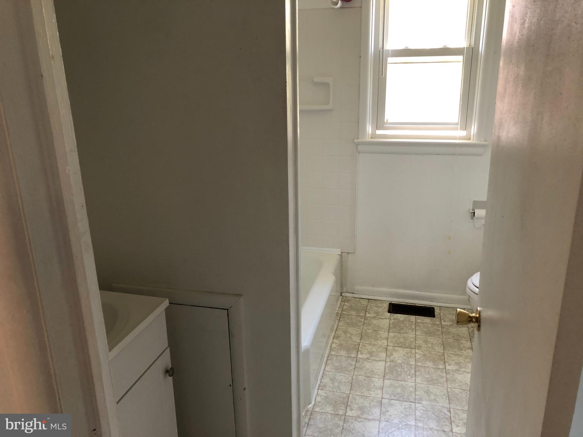 121 Taft Avenue Winchester, VA 22601 - Photo 5 of 7 a bathroom with a sink and a toilet