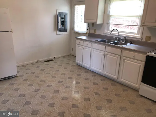 a kitchen with a sink and cabinets