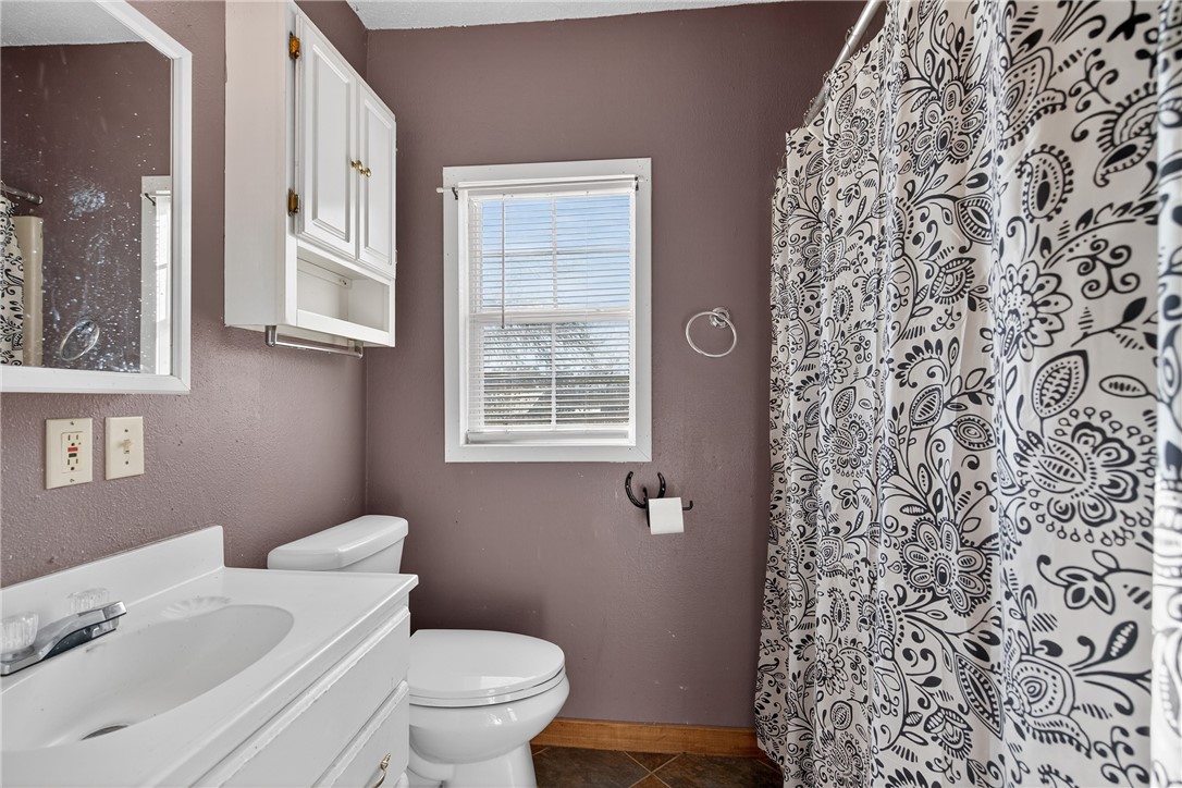 5752 Mockingbird Lane Mathis, TX 78368 - Photo 17 of 35 a bathroom with a toilet and a sink