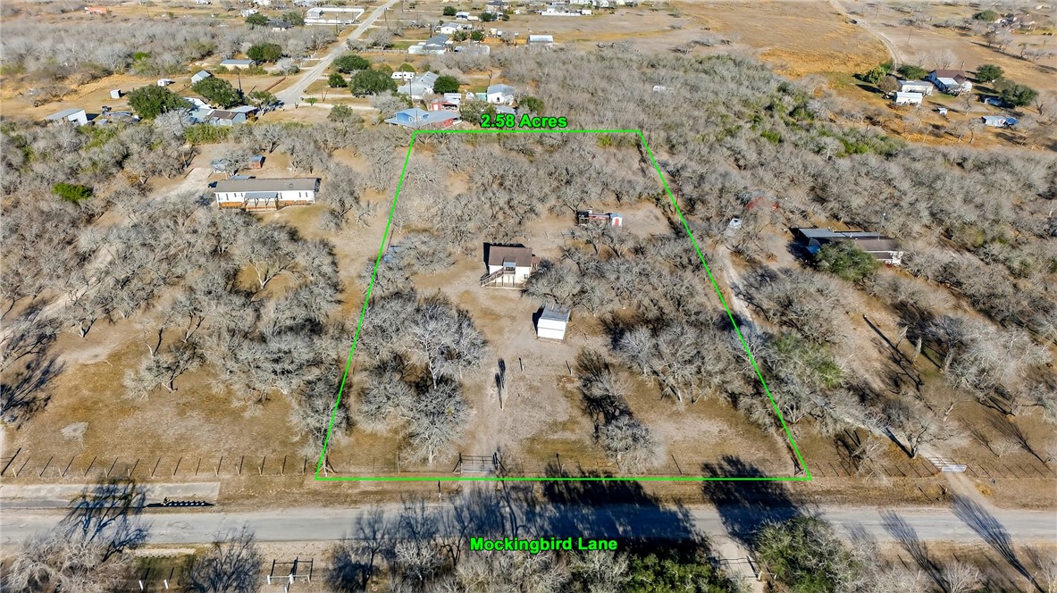 5752 Mockingbird Lane Mathis, TX 78368 - Photo 2 of 35 an aerial view of a houses with yard