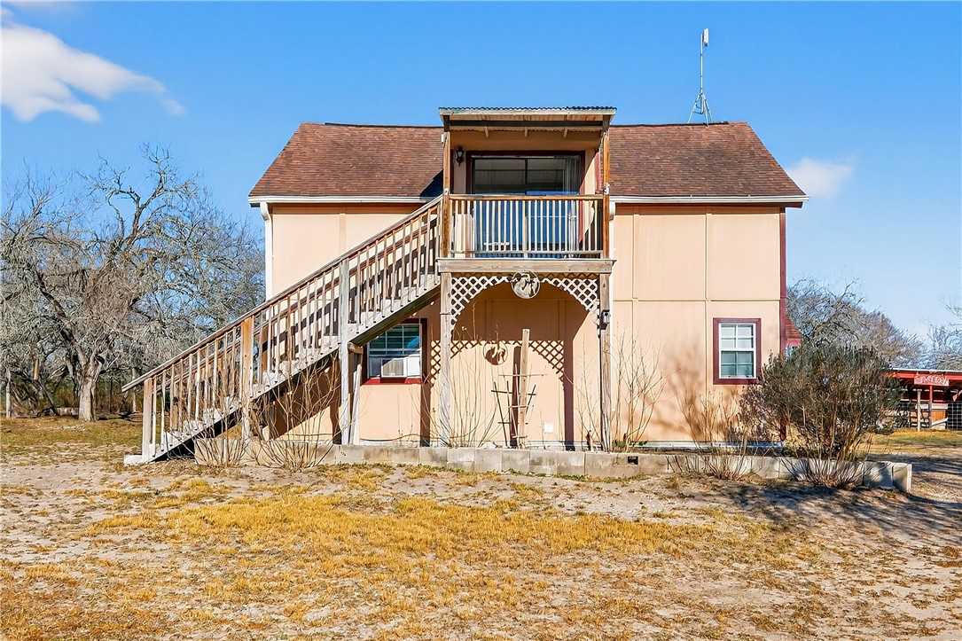 5752 Mockingbird Lane Mathis, TX 78368 - Photo 5 of 35 a house with trees in the background