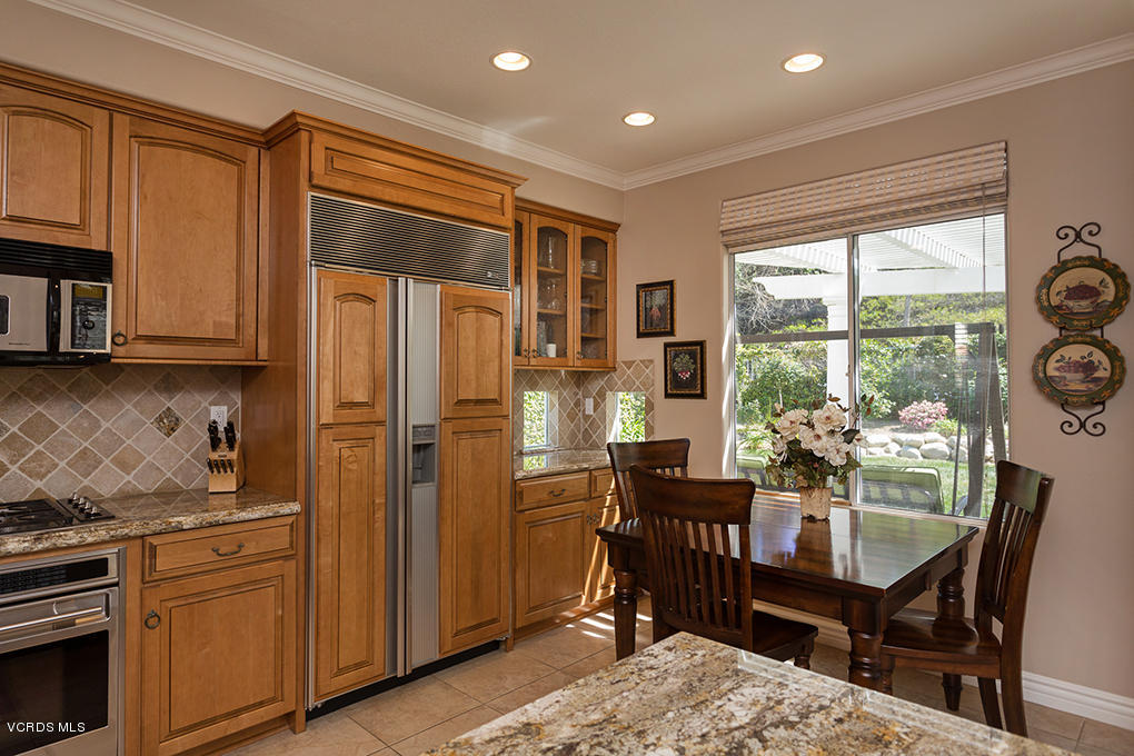 3978 Sunsetridge Road Moorpark, CA 93021 - Photo 14 of 31 a kitchen with refrigerator a stove and furniture