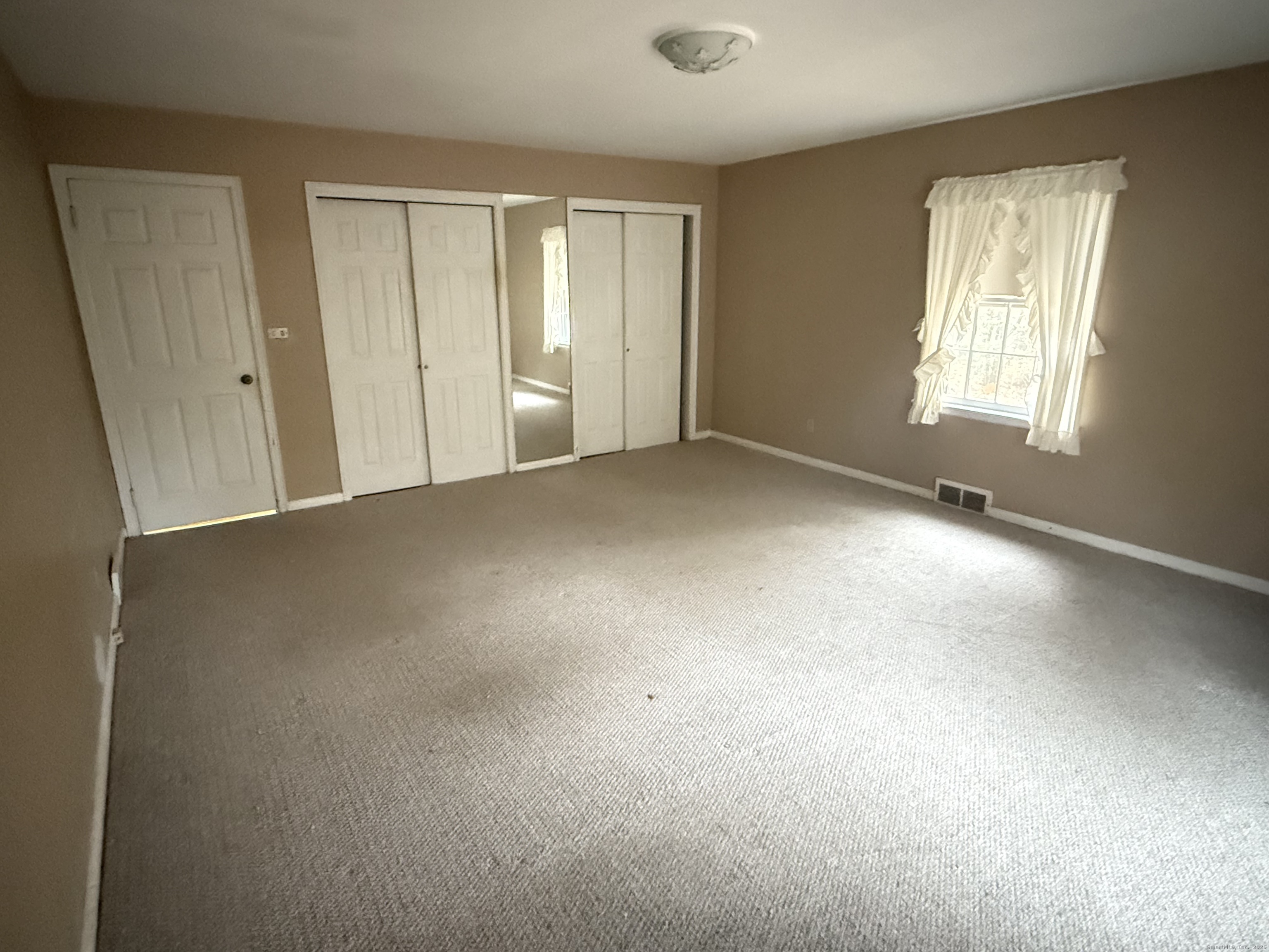 8 Nelson Place Fairfield, CT 06825 - Photo 11 of 32 an empty room with windows