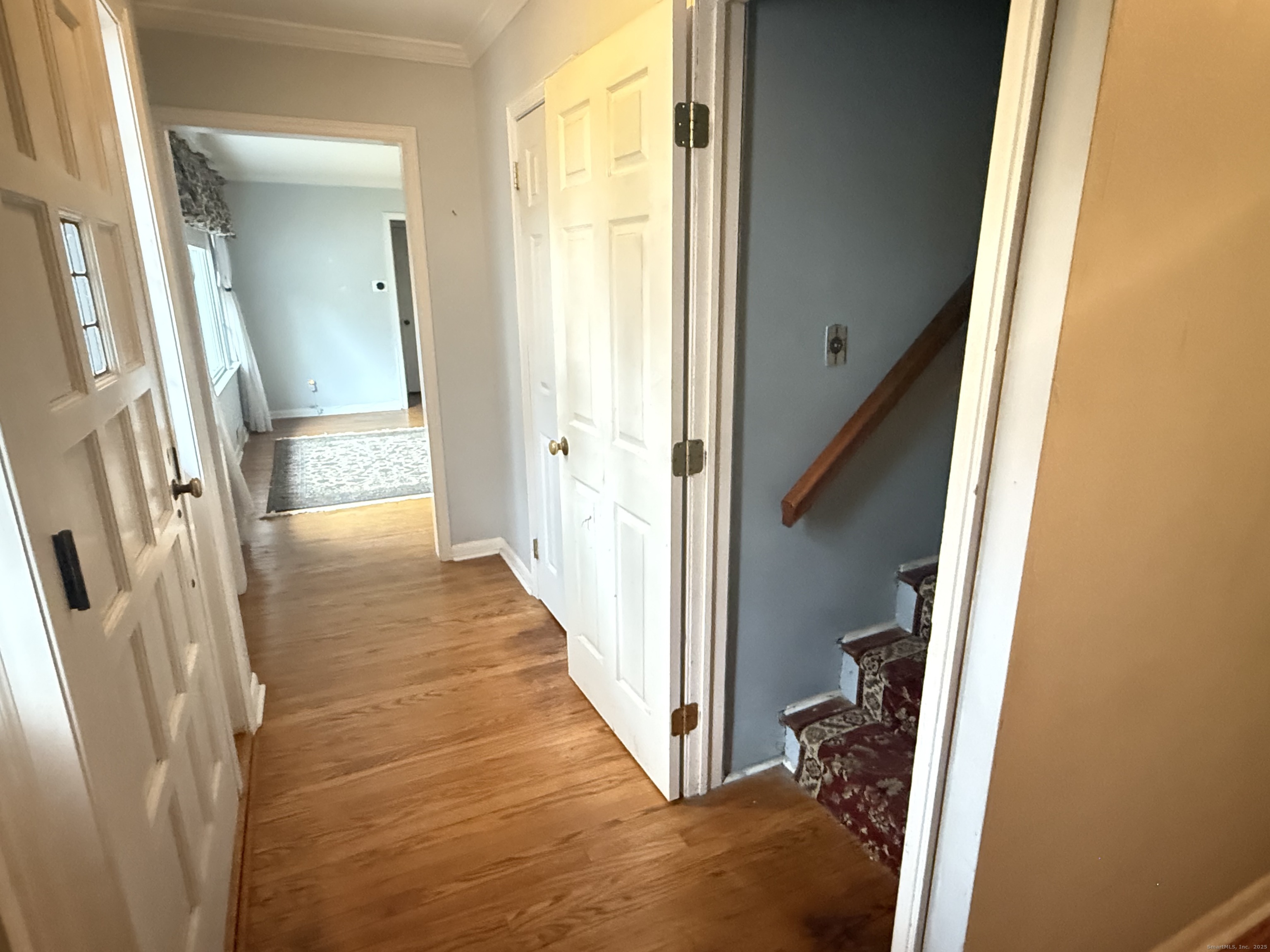 8 Nelson Place Fairfield, CT 06825 - Photo 18 of 32 a view of a hallway with wooden floor and staircase