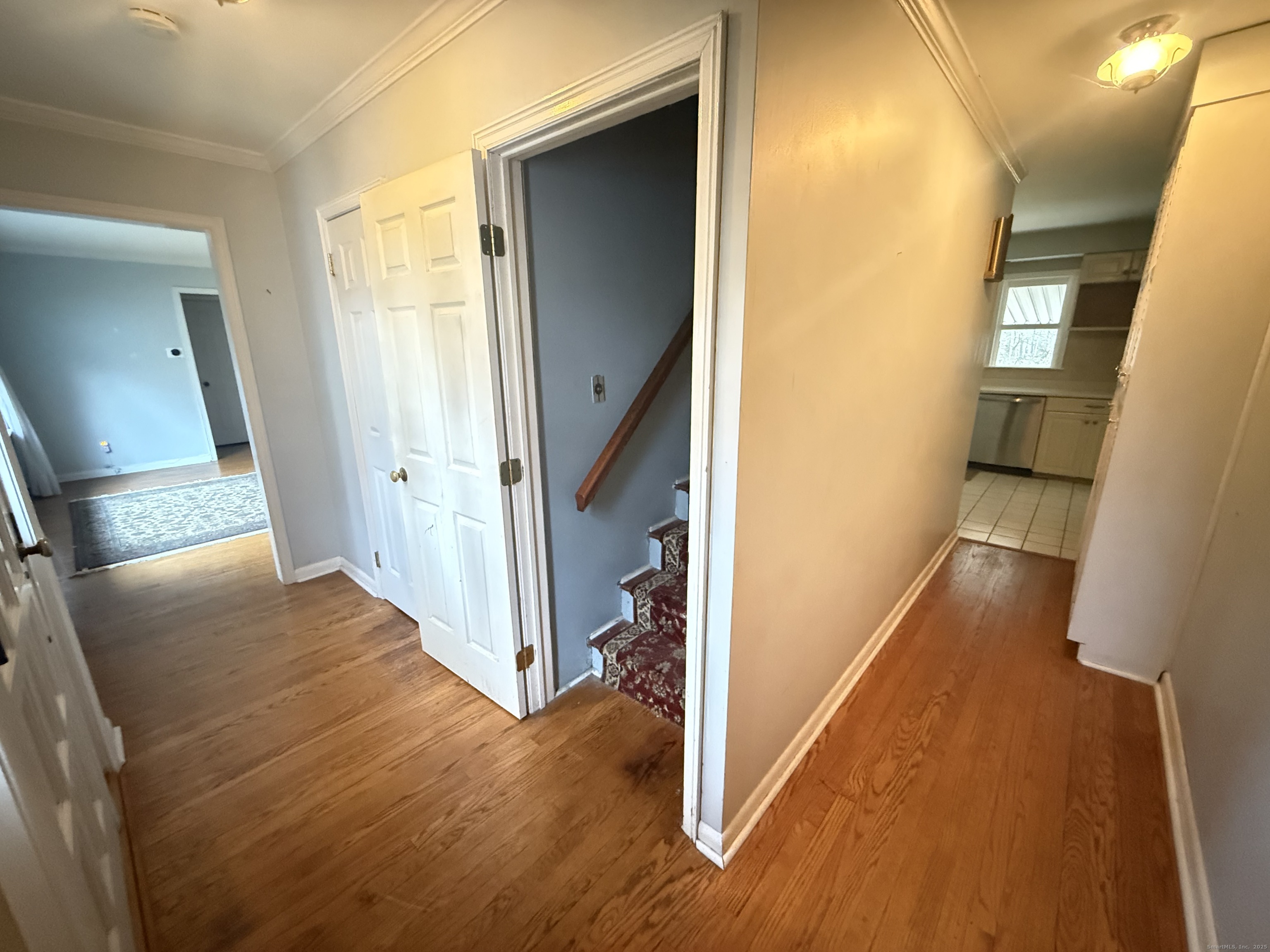 8 Nelson Place Fairfield, CT 06825 - Photo 19 of 32 a view of a hallway with wooden floor and staircase