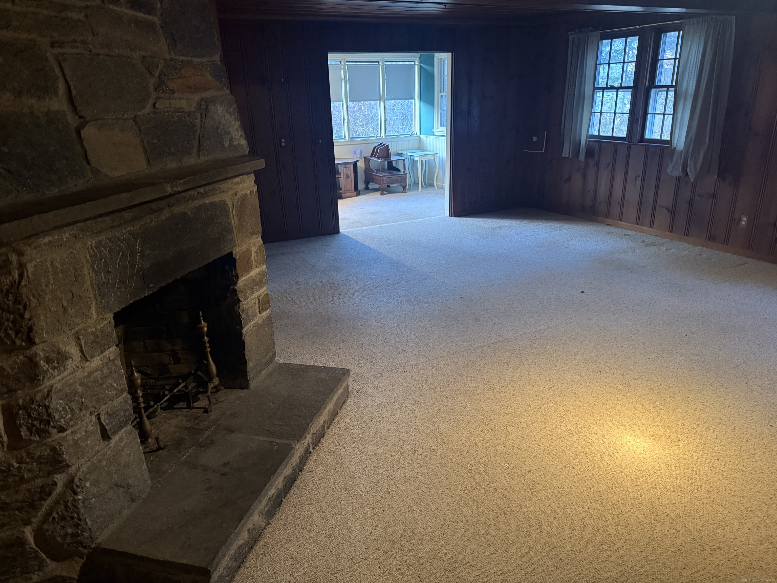 8 Nelson Place Fairfield, CT 06825 - Photo 23 of 32 a living room with furniture and a fireplace