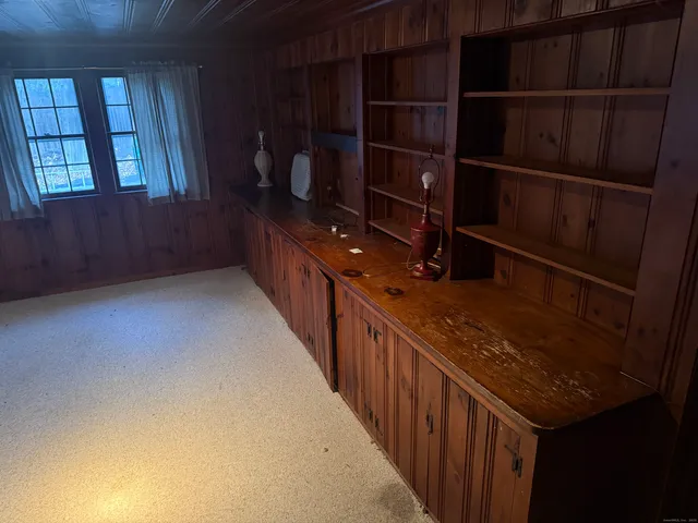 a hallway with wine cabinets