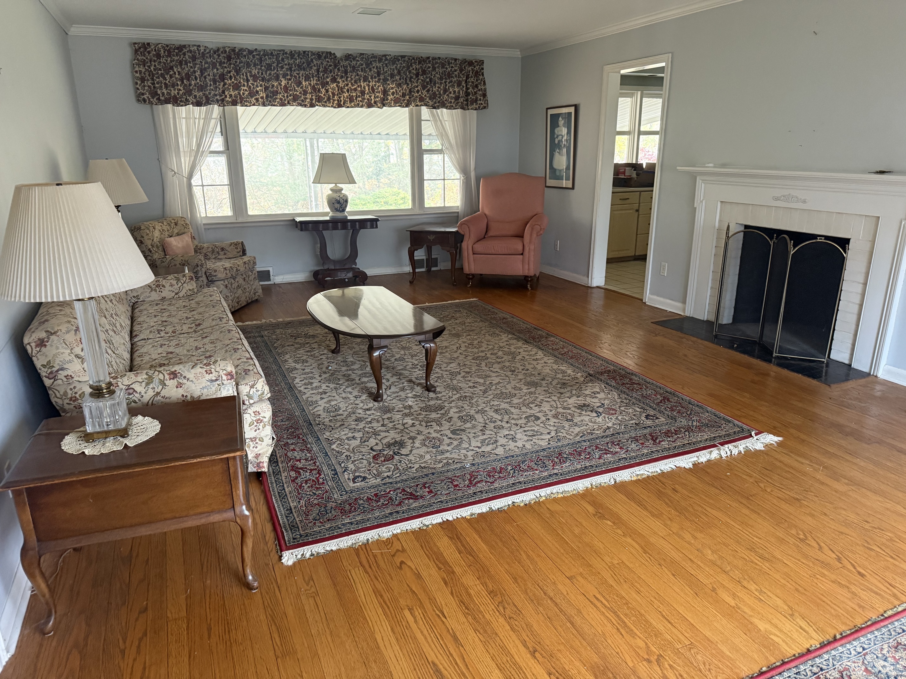 8 Nelson Place Fairfield, CT 06825 - Photo 3 of 32 a living room with furniture and a fireplace