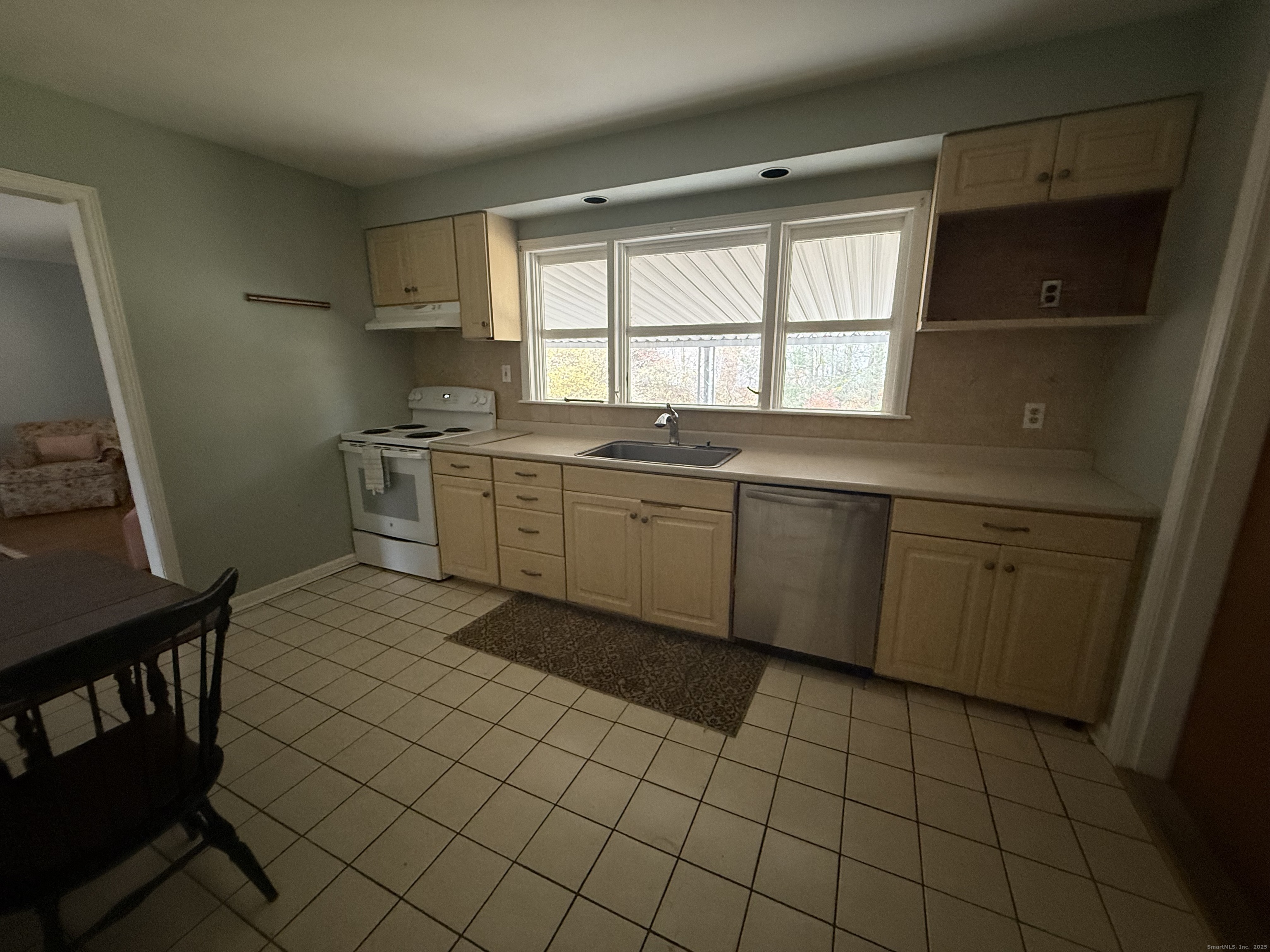 8 Nelson Place Fairfield, CT 06825 - Photo 5 of 32 a large kitchen with a sink a stove and a window